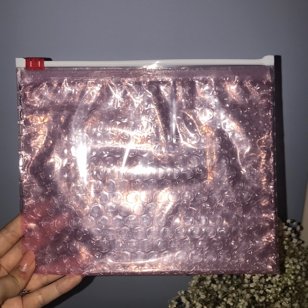 2 brand new glossier pouches!